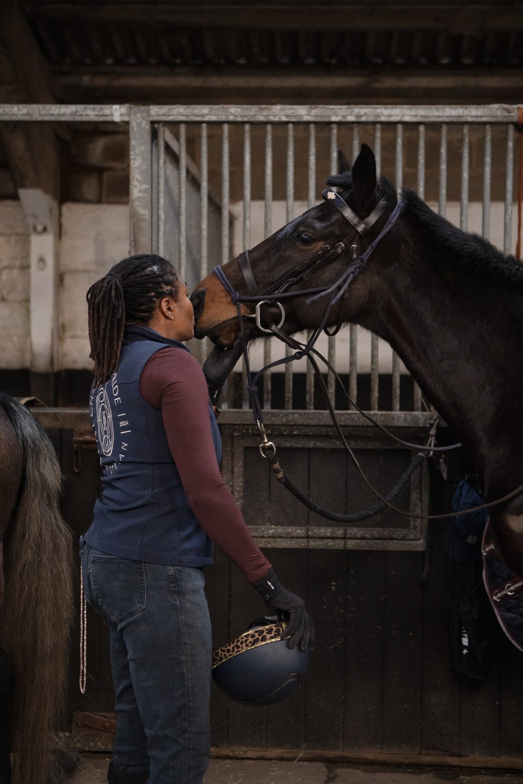 Founder adjusting the bridle on an equine Asset